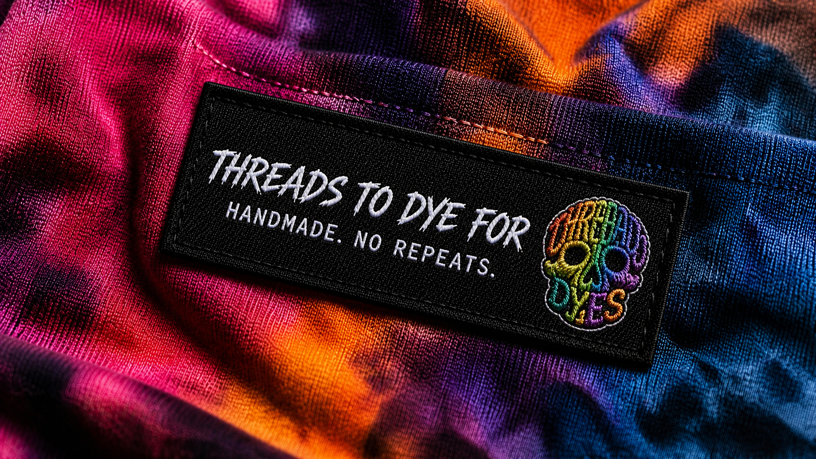 Threads to Dye For patch on tie-dye fabric